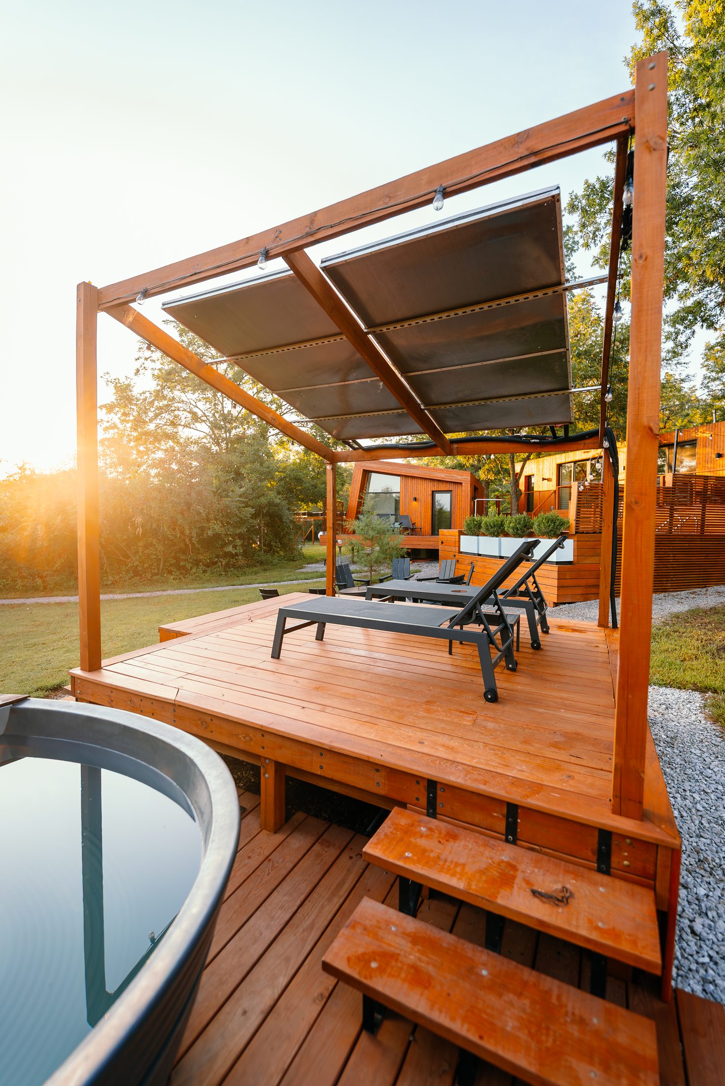 Hot tub with gazebo deck and lounger chairs